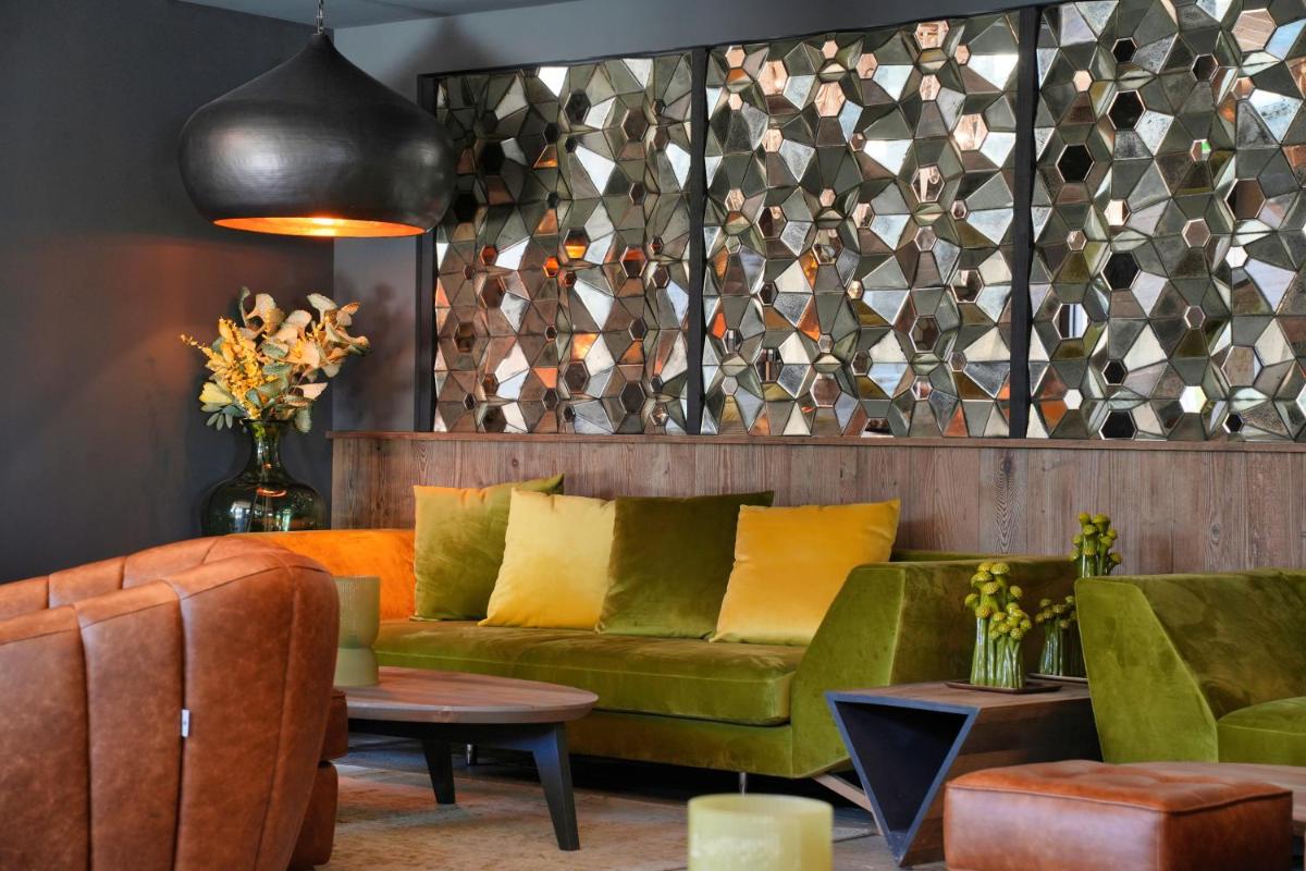 Coin salon dans l'établissement Les Regalia Hôtel & Spa