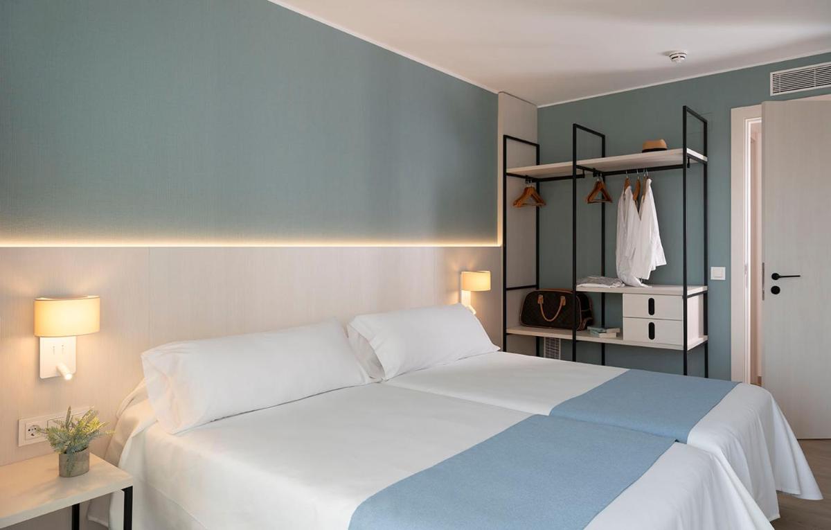 Cama o camas de una habitación en Aparthotel Costa Encantada