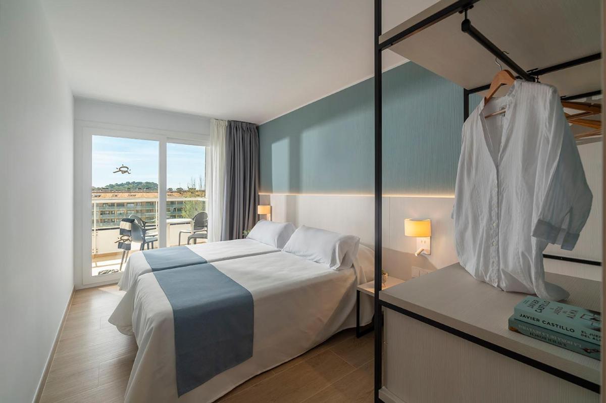 Cama o camas de una habitación en Aparthotel Costa Encantada