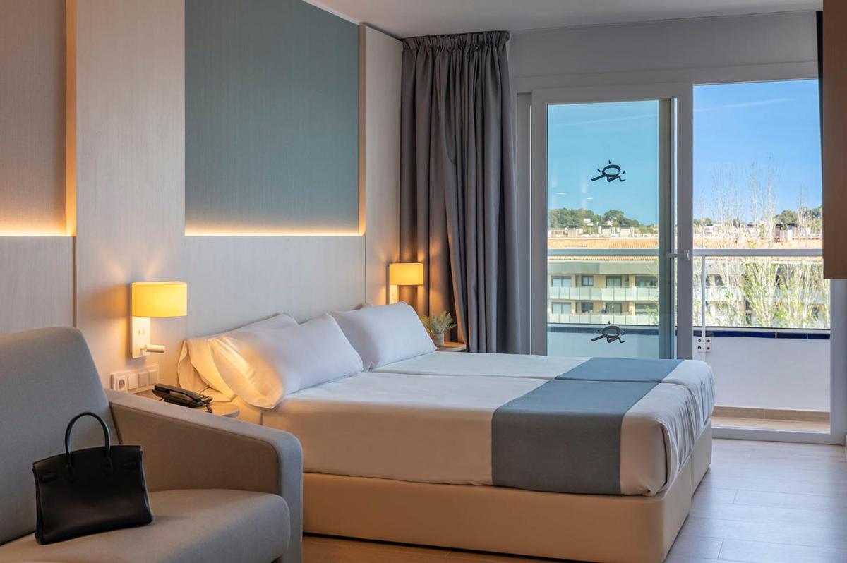 Cama o camas de una habitación en Aparthotel Costa Encantada