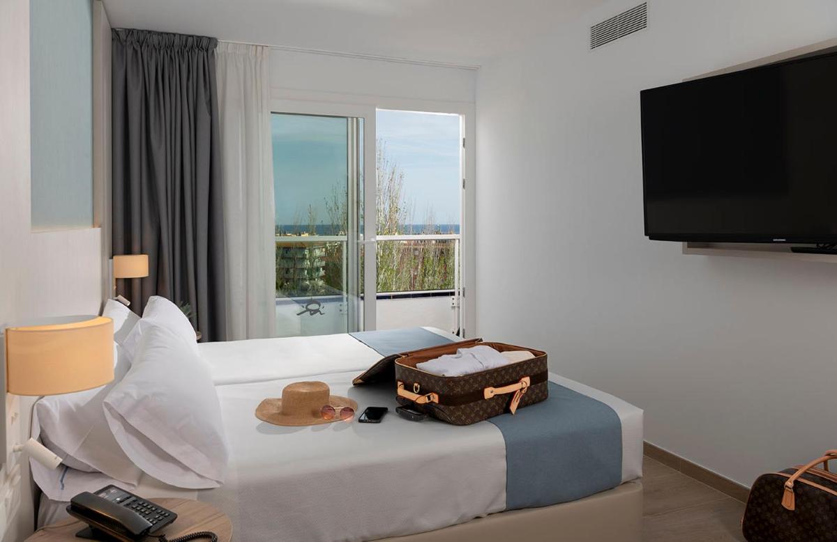 Cama o camas de una habitación en Aparthotel Costa Encantada