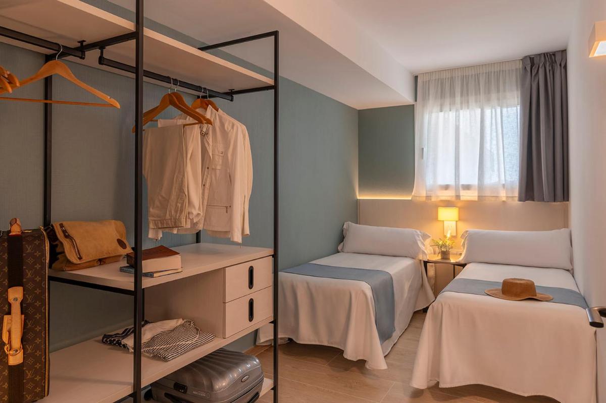 Cama o camas de una habitación en Aparthotel Costa Encantada