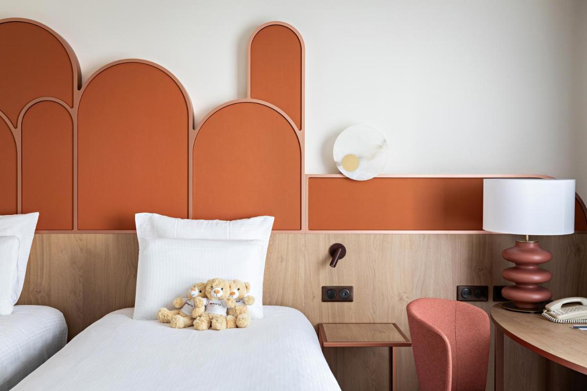 Un ou plusieurs lits dans un hébergement de l'établissement Pullman Paris Centre - Bercy