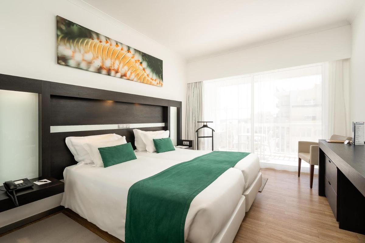 Uma cama ou camas num quarto em Jupiter Algarve Hotel - Beach & Spa