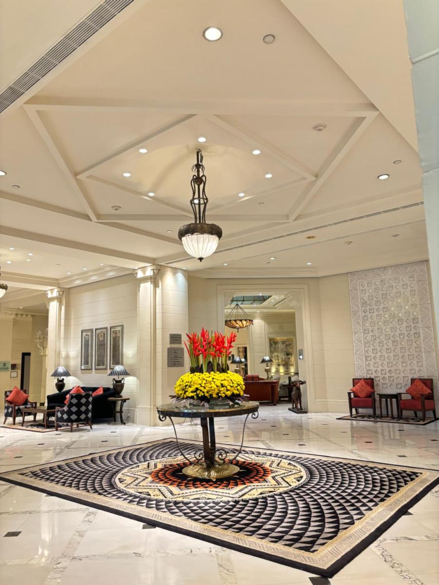 a lobby with a table with flowers on it at ITC Kakatiya, a Luxury Collection Hotel, Hyderabad in Hyderabad
