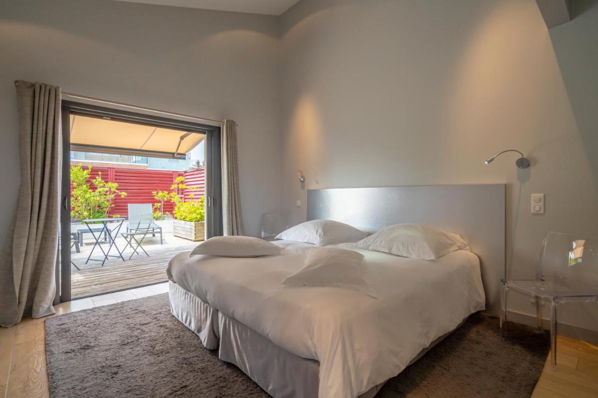 Un ou plusieurs lits dans un hébergement de l'établissement Lafitenia Resort