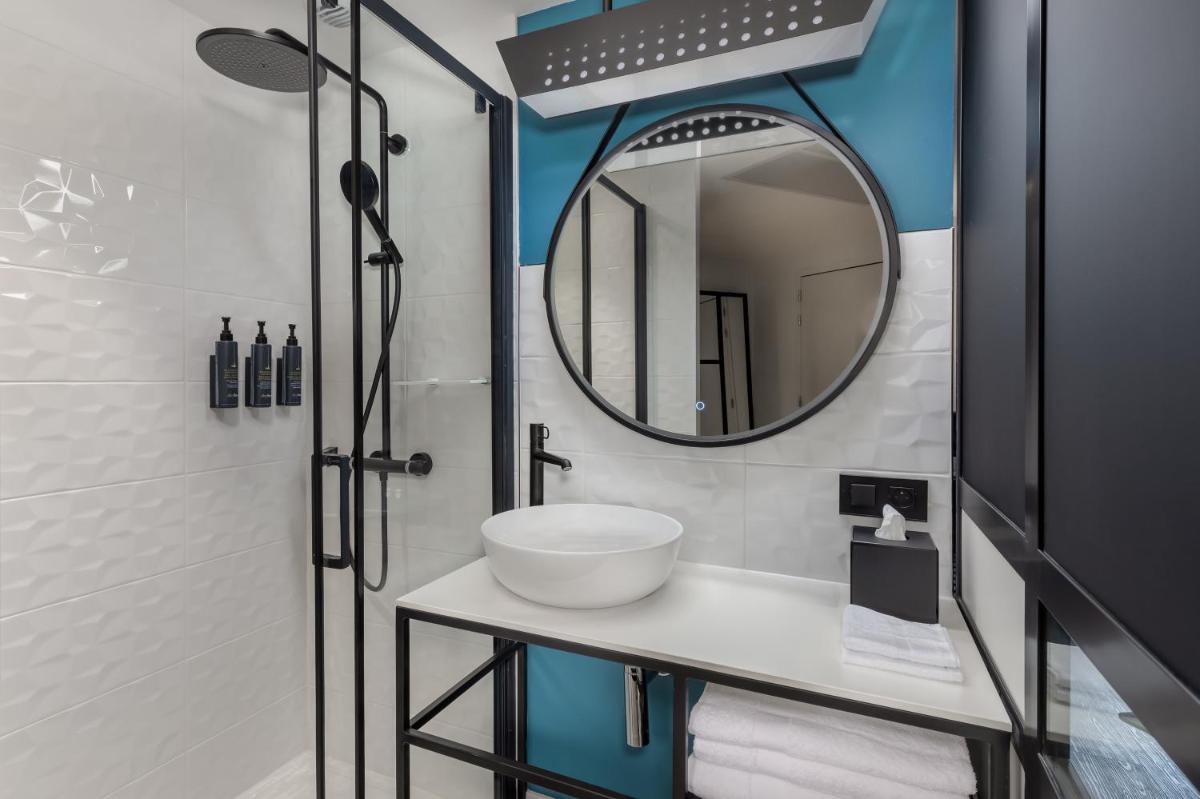 Salle de bains dans l'établissement Aloft Dijon