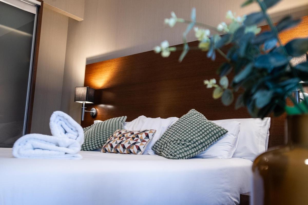 Cama o camas de una habitación en AZZ Valencia Congress Hotel & Spa