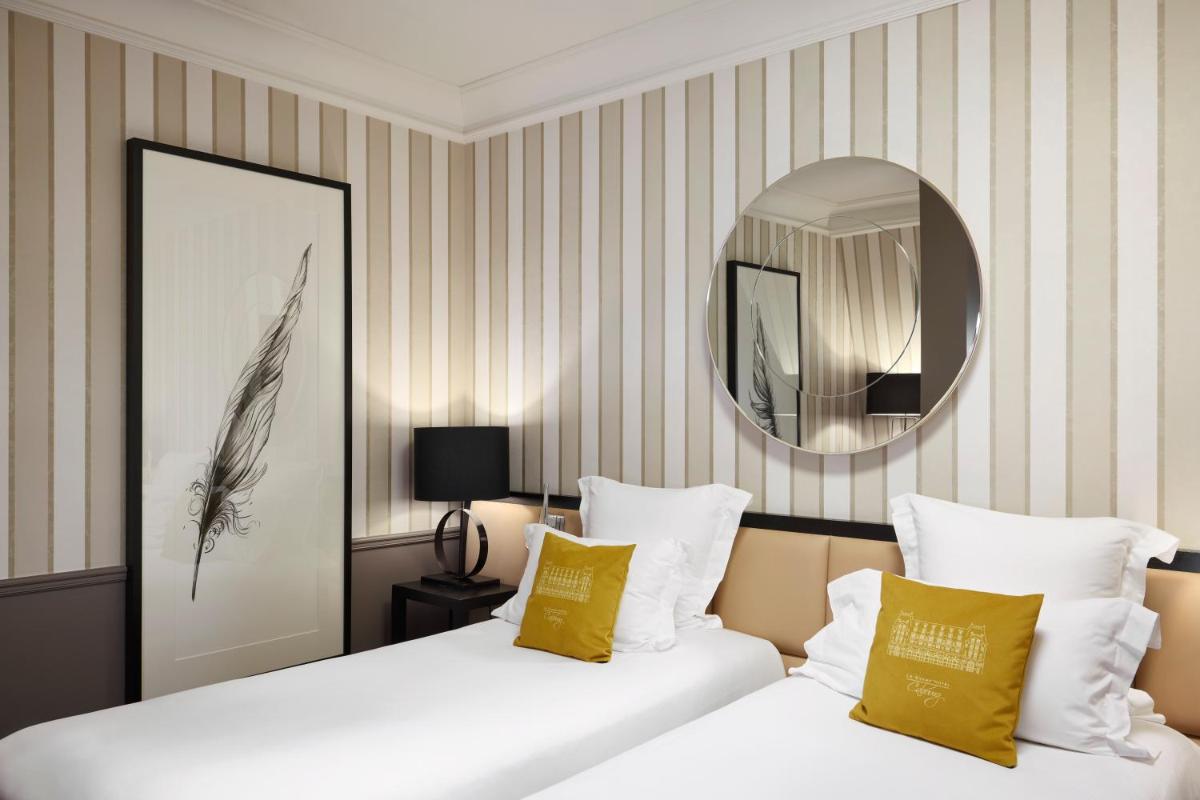 Un ou plusieurs lits dans un hébergement de l'établissement Le Grand Hotel de Cabourg - MGallery Collection