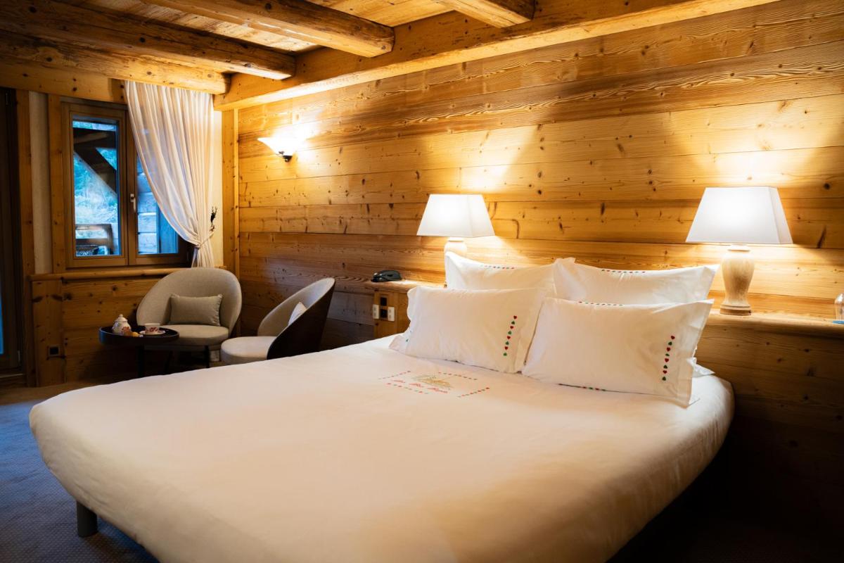 Un ou plusieurs lits dans un hébergement de l'établissement Hôtel-Restaurant Les Bas-Rupts, Singuliers Hôtel