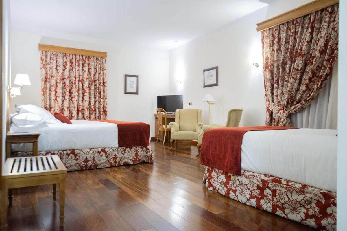 Cama o camas de una habitación en AZZ Peñafiel Las Claras Hotel & Spa
