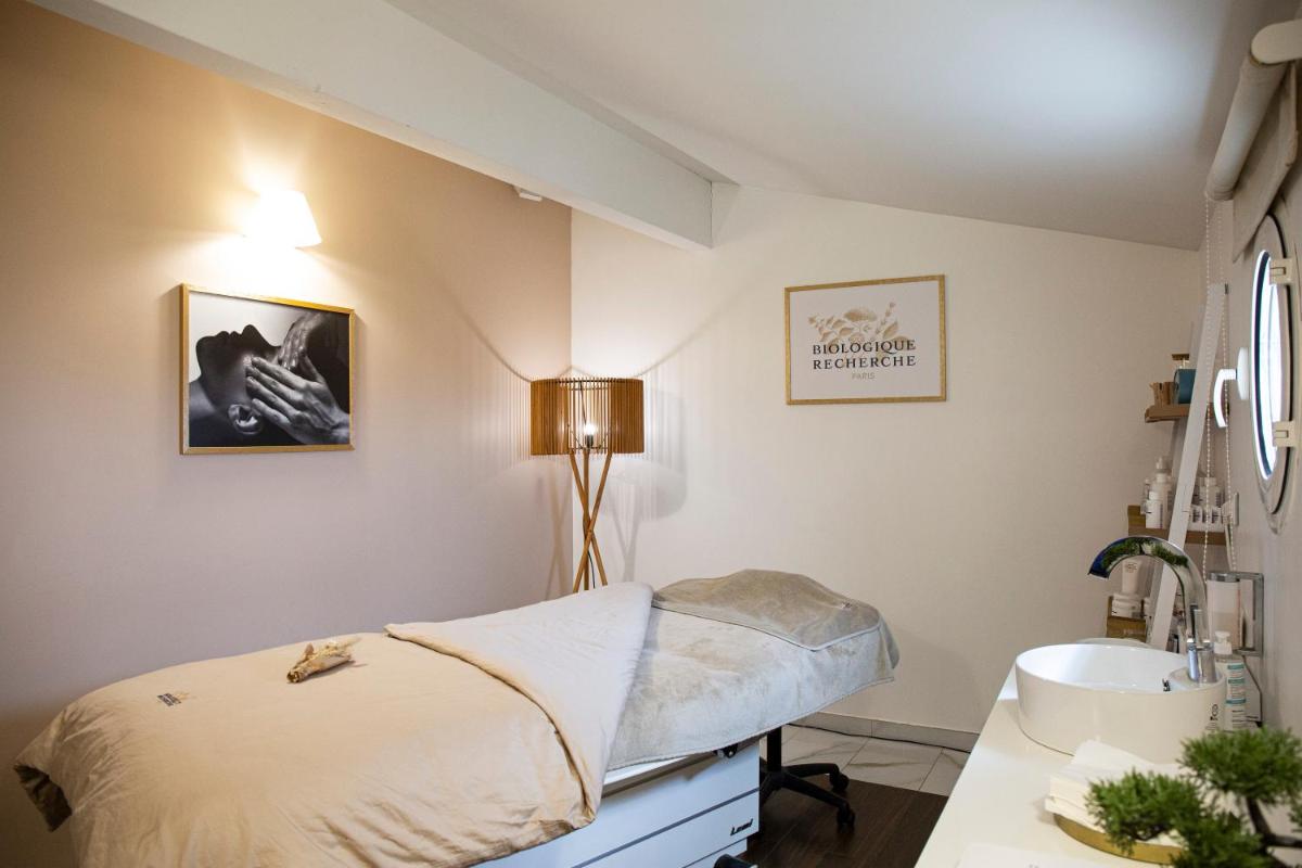 Un ou plusieurs lits dans un hébergement de l'établissement Relais et Châteaux Thalasso & Spa Ile de la Lagune