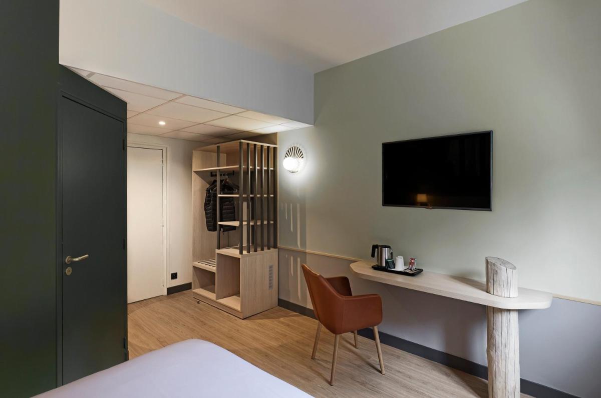 Télévision ou salle de divertissement dans l'établissement Mercure Saint Nectaire - Spa & Bien-Être