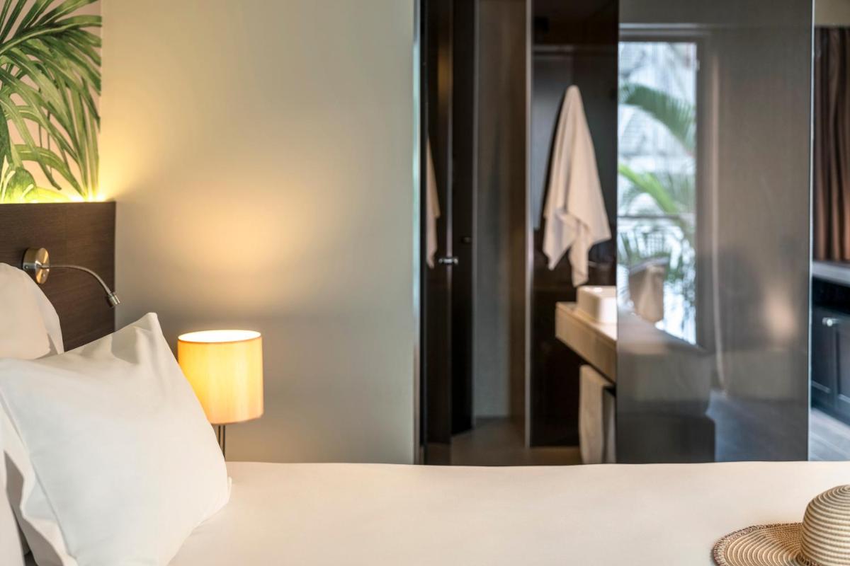 Uma cama ou camas num quarto em TUI Blue Gardens - Adults-only - Savoy Signature