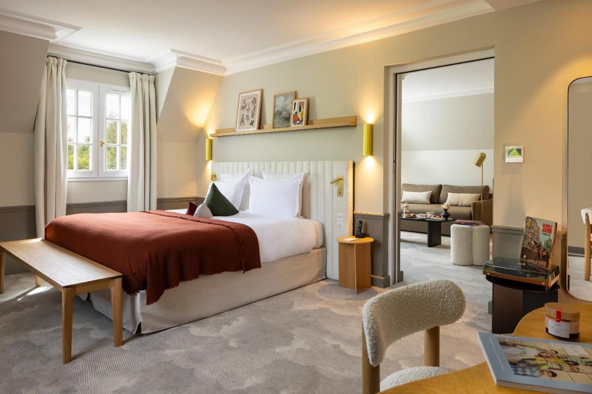 Un ou plusieurs lits dans un hébergement de l'établissement Briqueterie Champagne, A Beauvallon Hotel
