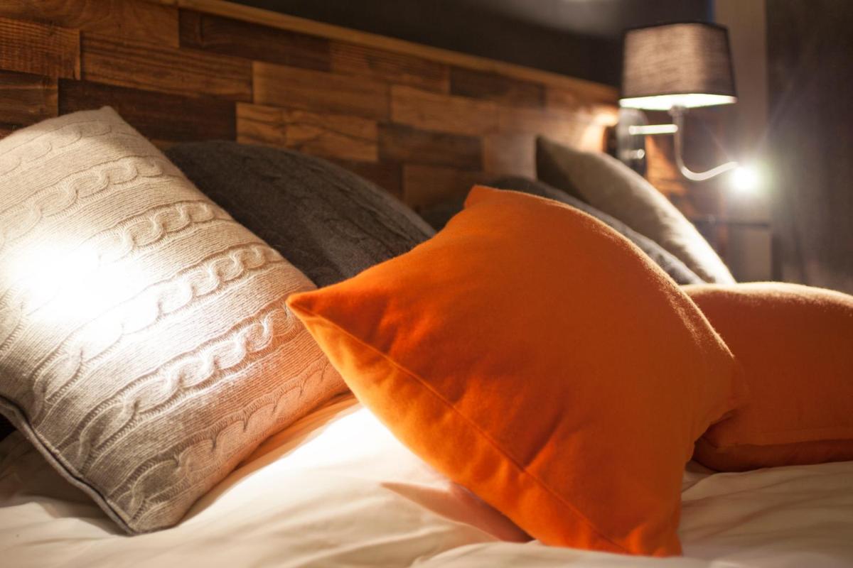 Un ou plusieurs lits dans un hébergement de l'établissement Hôtel Saint Charles Val Cenis