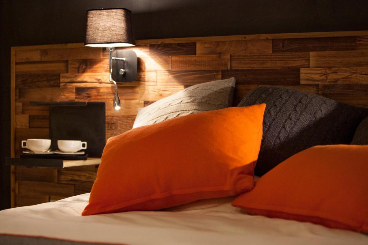 Un ou plusieurs lits dans un hébergement de l'établissement Hôtel Saint Charles Val Cenis