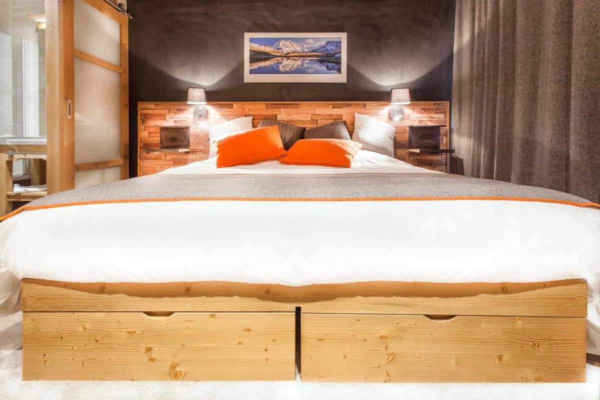 Un ou plusieurs lits dans un hébergement de l'établissement Hôtel Saint Charles Val Cenis