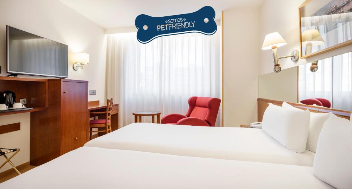 Cama o camas de una habitación en Ilunion Les Corts Spa