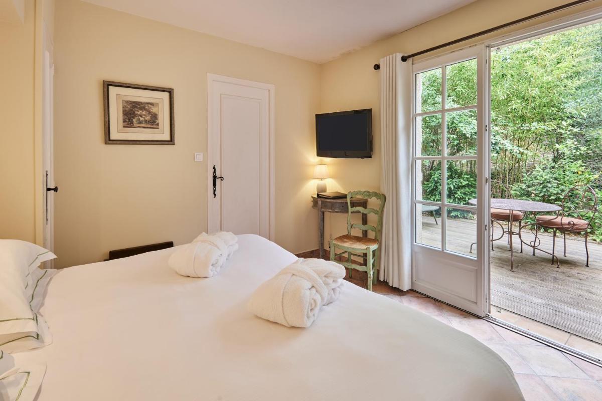 Un ou plusieurs lits dans un hébergement de l'établissement La Bastide du Calalou Hotel & Spa, BW Signature Collection