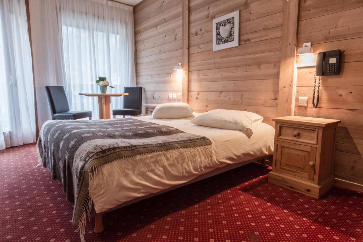 Un ou plusieurs lits dans un hébergement de l'établissement Hotel Club Le Crêt