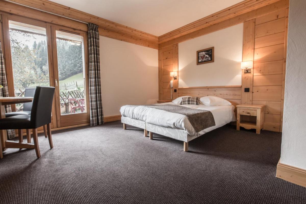 Un ou plusieurs lits dans un hébergement de l'établissement Hotel Club Le Crêt
