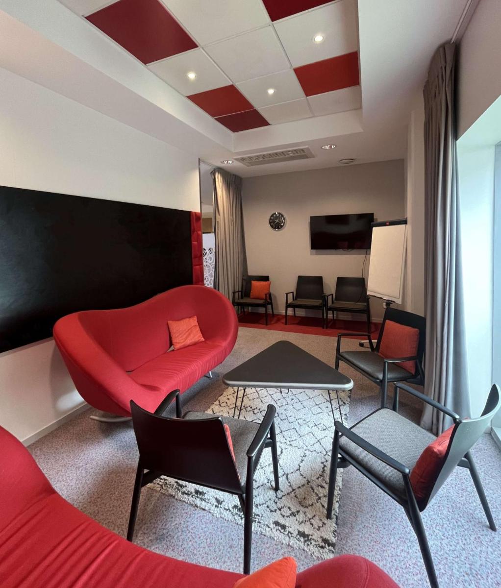 Télévision ou salle de divertissement dans l'établissement Radisson Blu Hotel Toulouse Airport