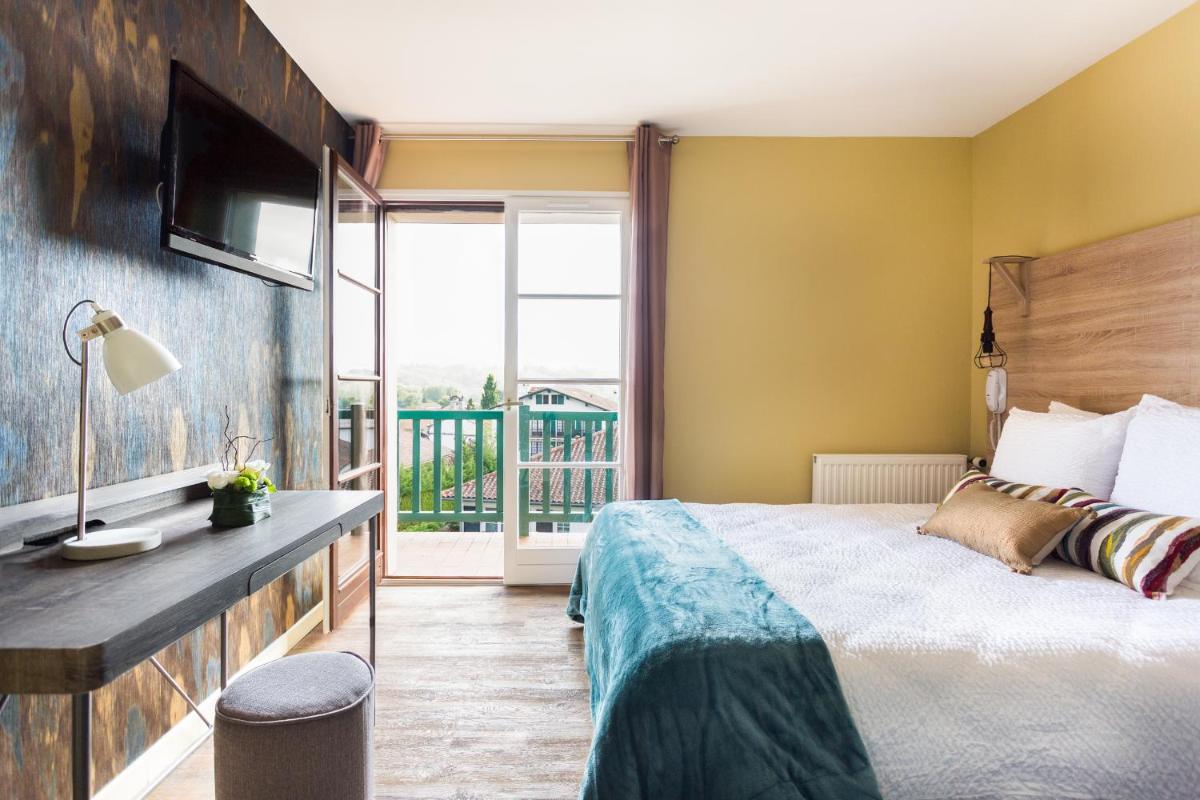 Un ou plusieurs lits dans un hébergement de l'établissement Hotel Mendionde