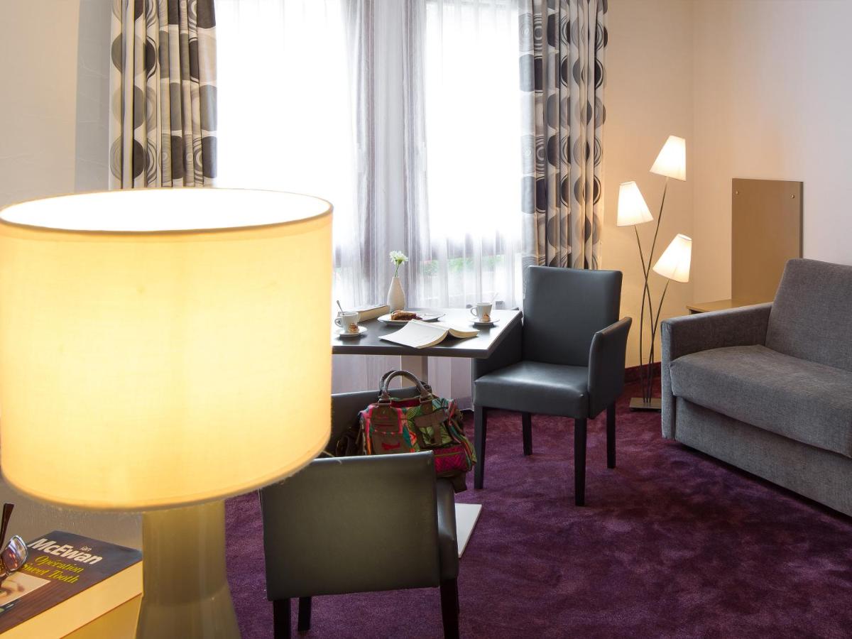 Coin salon dans l'établissement Hotel Restaurant & Spa Verte Vallée