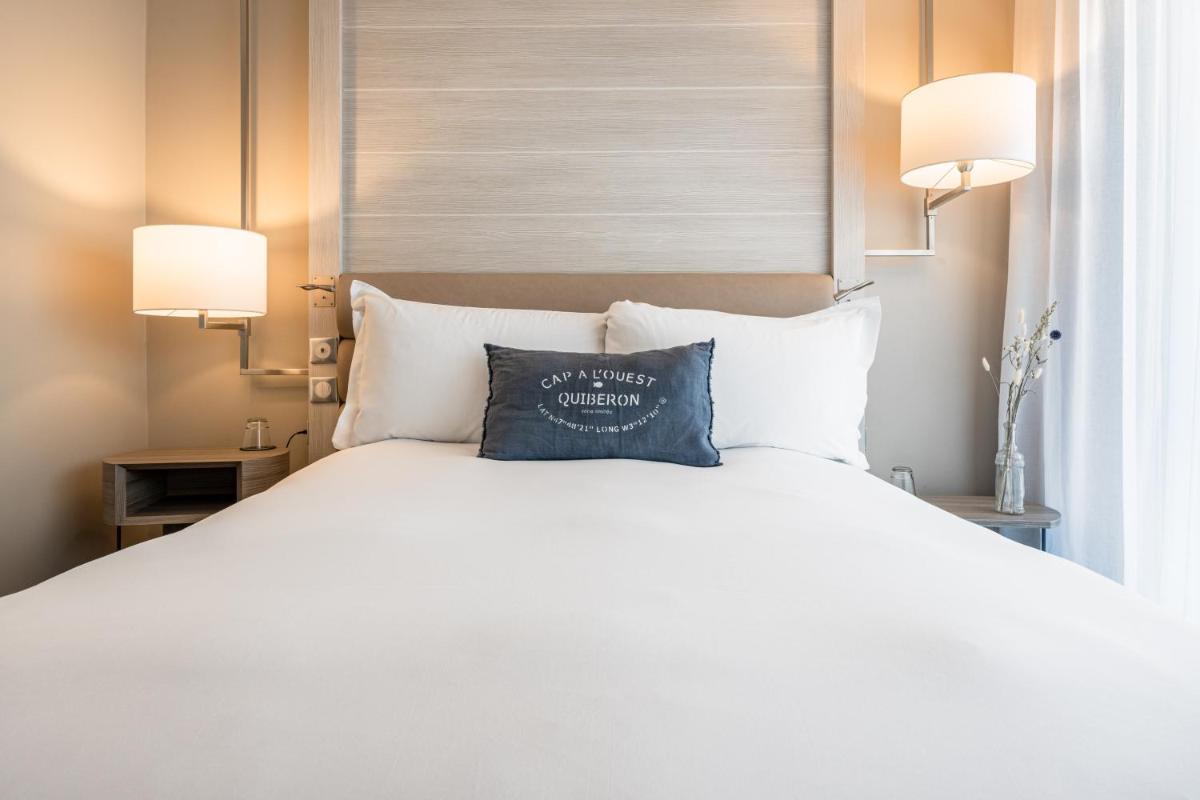Un ou plusieurs lits dans un hébergement de l'établissement Sofitel Quiberon Thalassa sea & spa