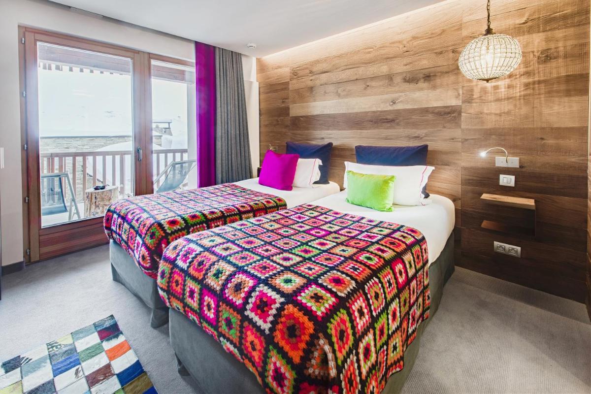 Un ou plusieurs lits dans un hébergement de l'établissement Hotel Pashmina Le Refuge