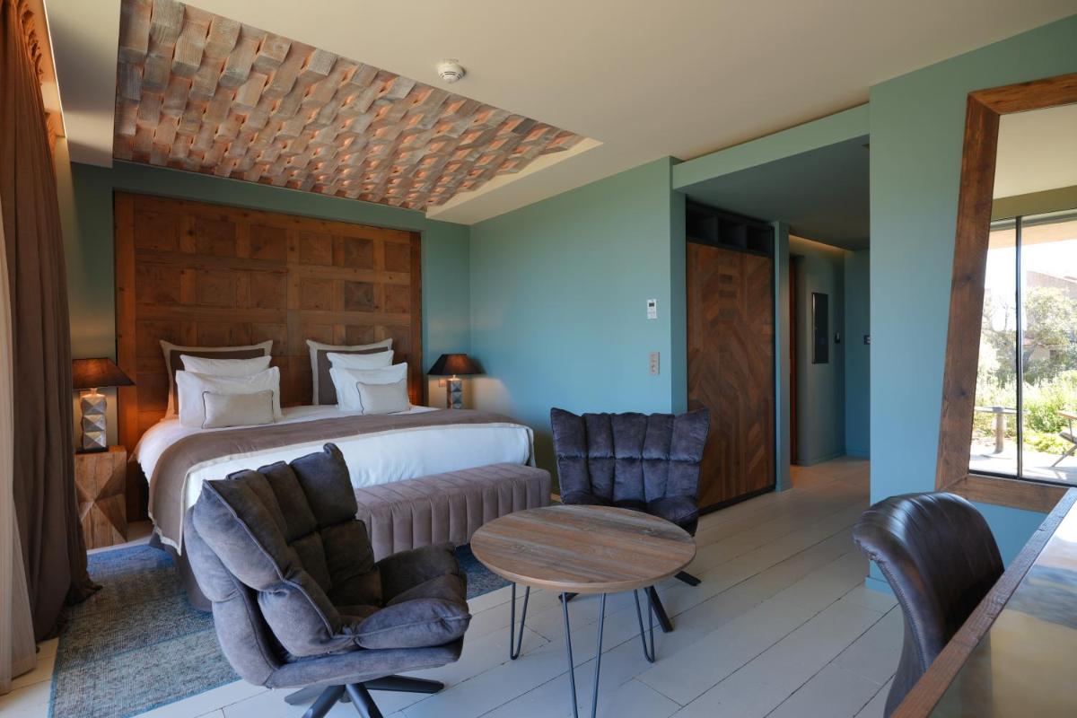 Un ou plusieurs lits dans un hébergement de l'établissement Les Regalia Hôtel & Spa