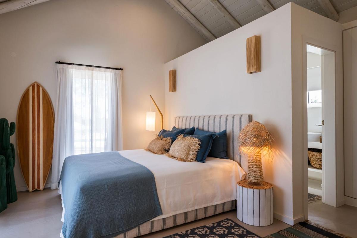 Uma cama ou camas num quarto em Independente Comporta