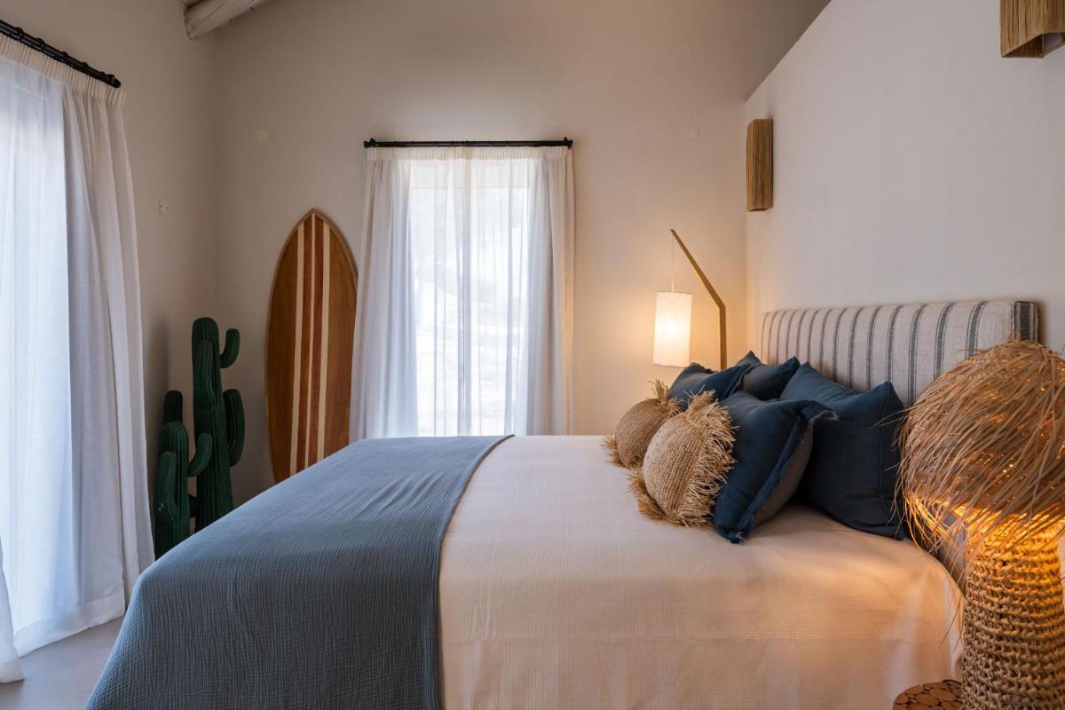Uma cama ou camas num quarto em Independente Comporta