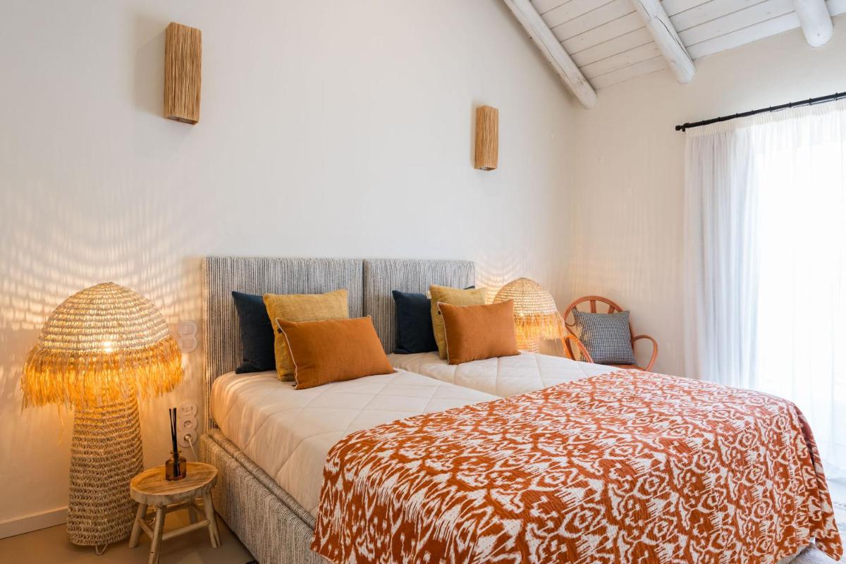 Uma cama ou camas num quarto em Independente Comporta