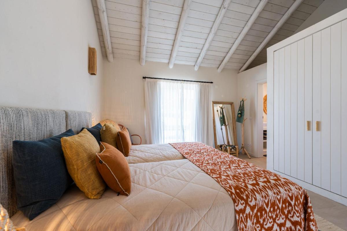 Uma cama ou camas num quarto em Independente Comporta