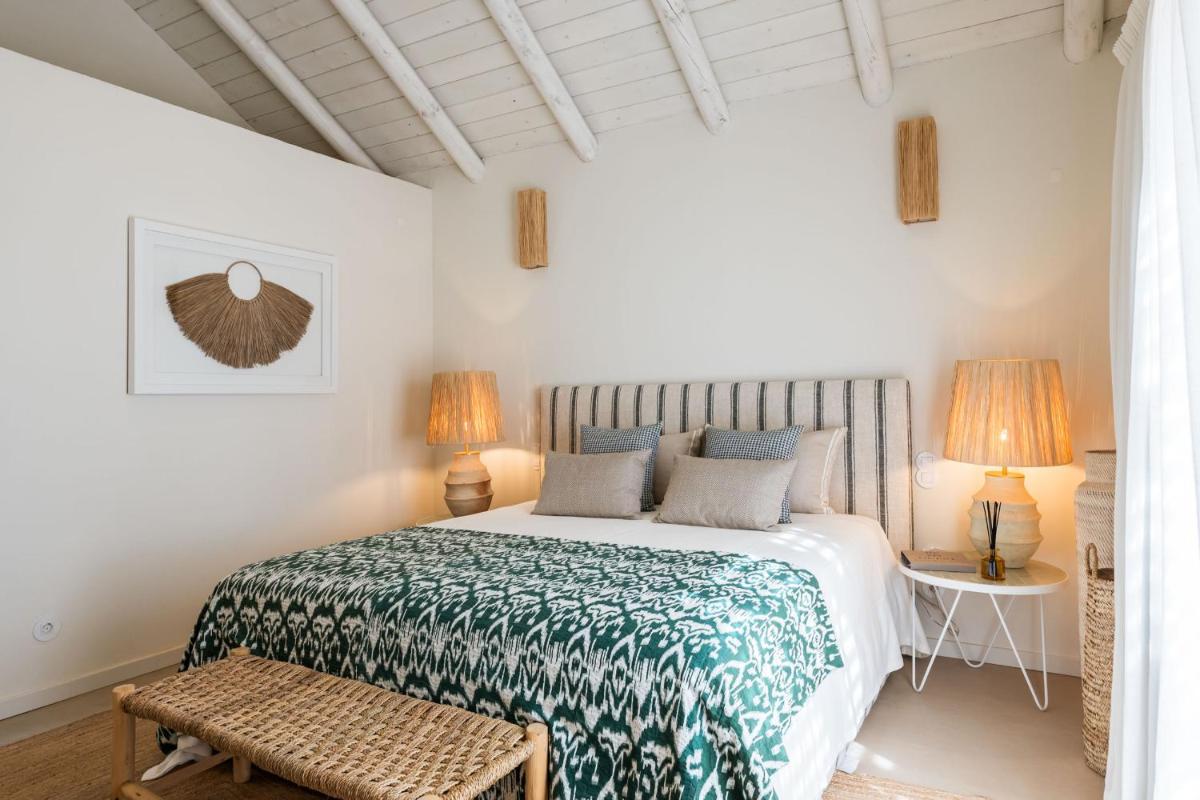 Uma cama ou camas num quarto em Independente Comporta