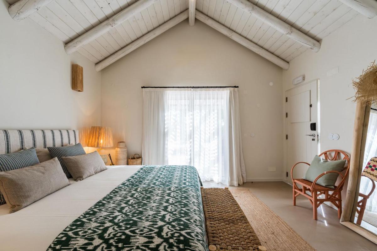 Uma cama ou camas num quarto em Independente Comporta