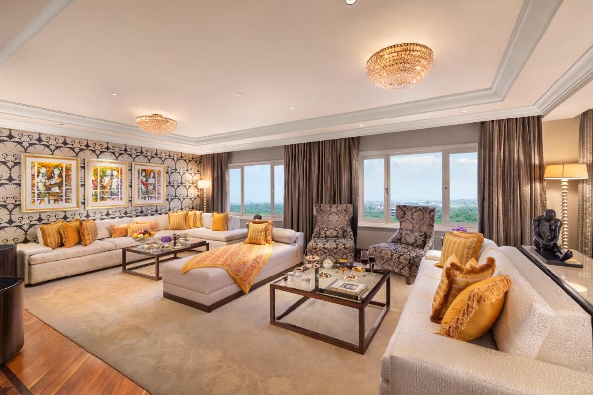 a large living room with couches and chairs at Taj Palace, New Delhi in New Delhi a large living room with couches and chairs at Taj Palace, New Delhi in New Delhi