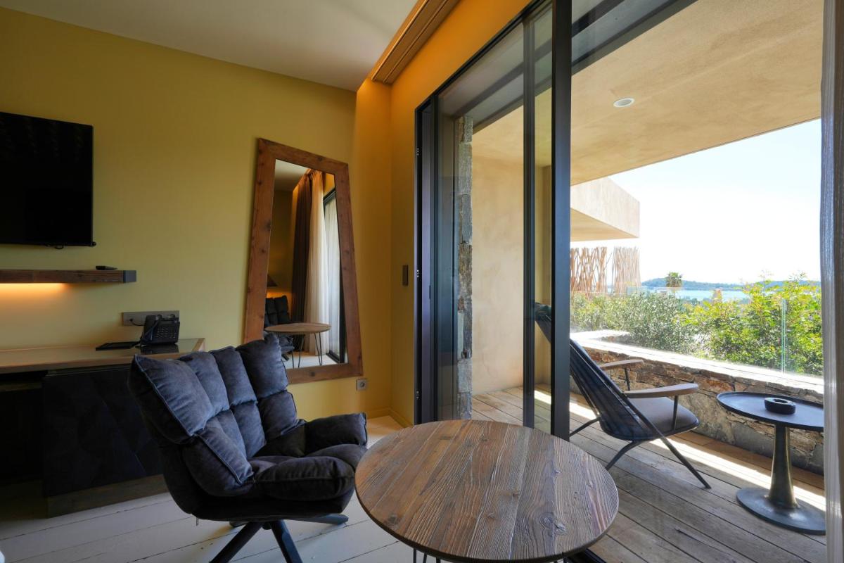 Coin salon dans l'établissement Les Regalia Hôtel & Spa