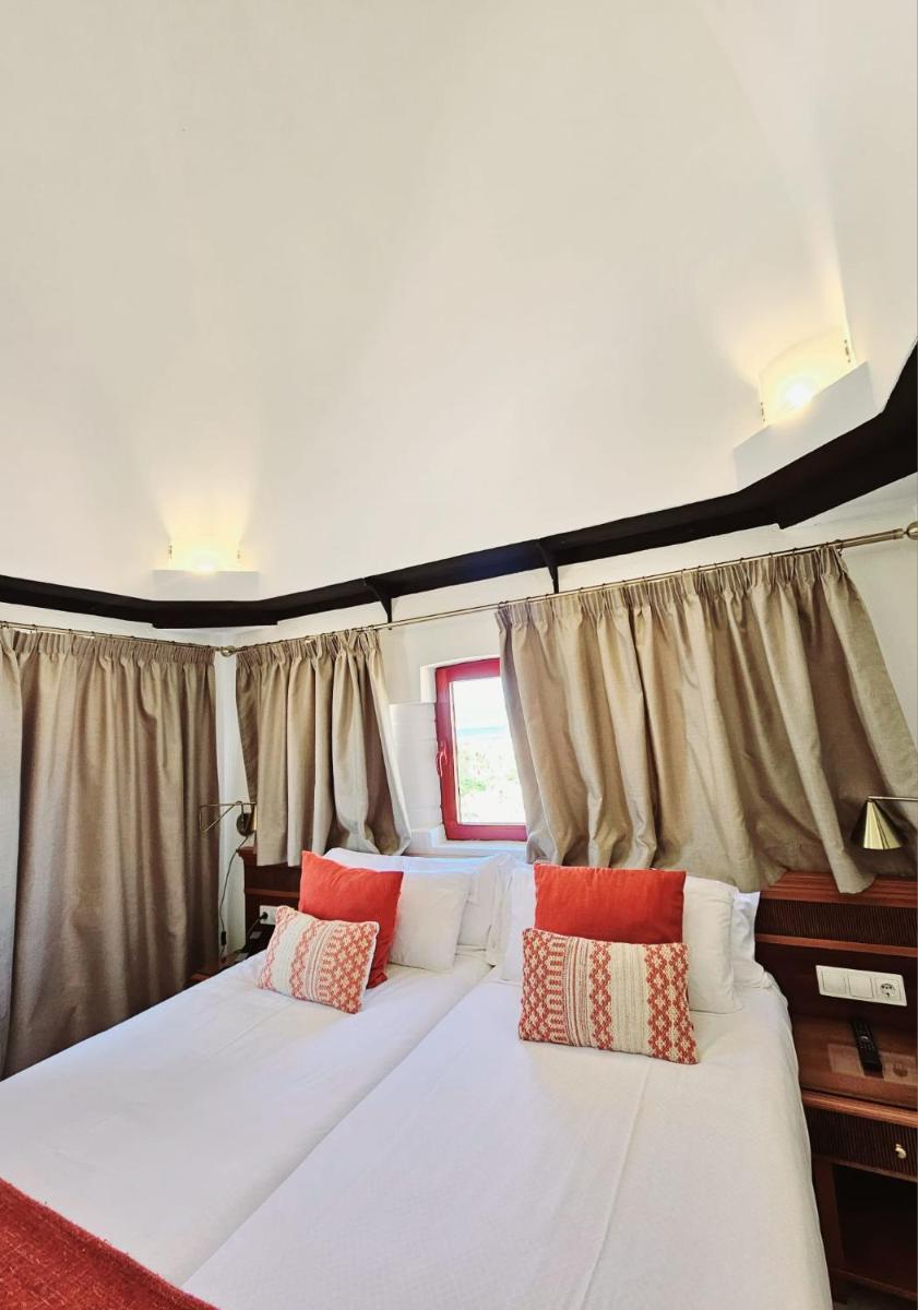 Cama o camas de una habitación en Hotel Ciutat Jardi