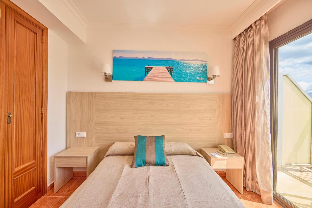 Cama o camas de una habitación en Ilusion Markus & Spa