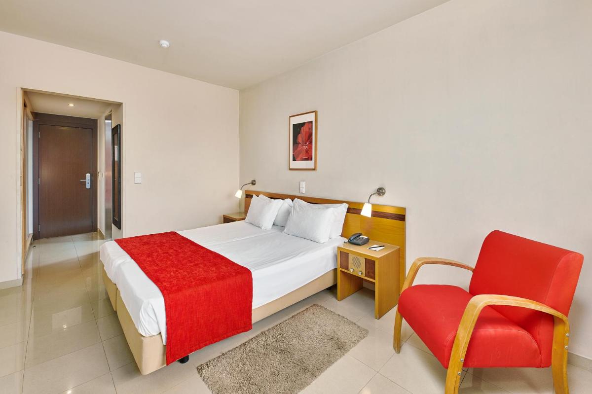 Uma cama ou camas num quarto em Rocamar Exclusive Hotel & Spa - Adults Only