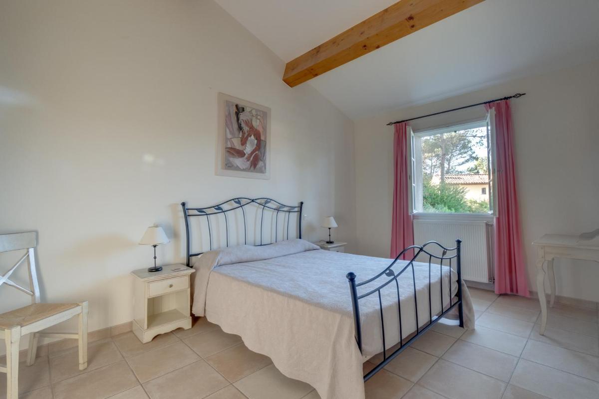 Un ou plusieurs lits dans un hébergement de l'établissement Les Appartements et Maisons du Domaine de Saint Endréol Golf & Spa Resort