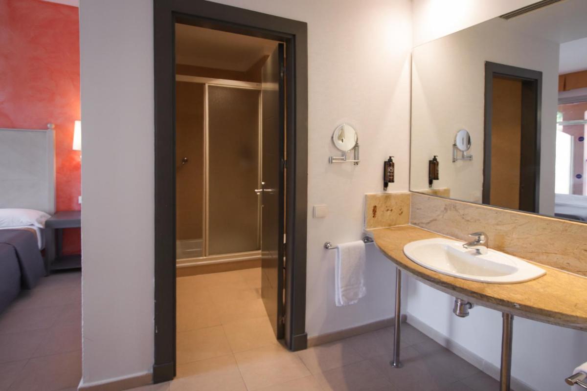 Cama o camas de una habitación en Ohtels Islantilla