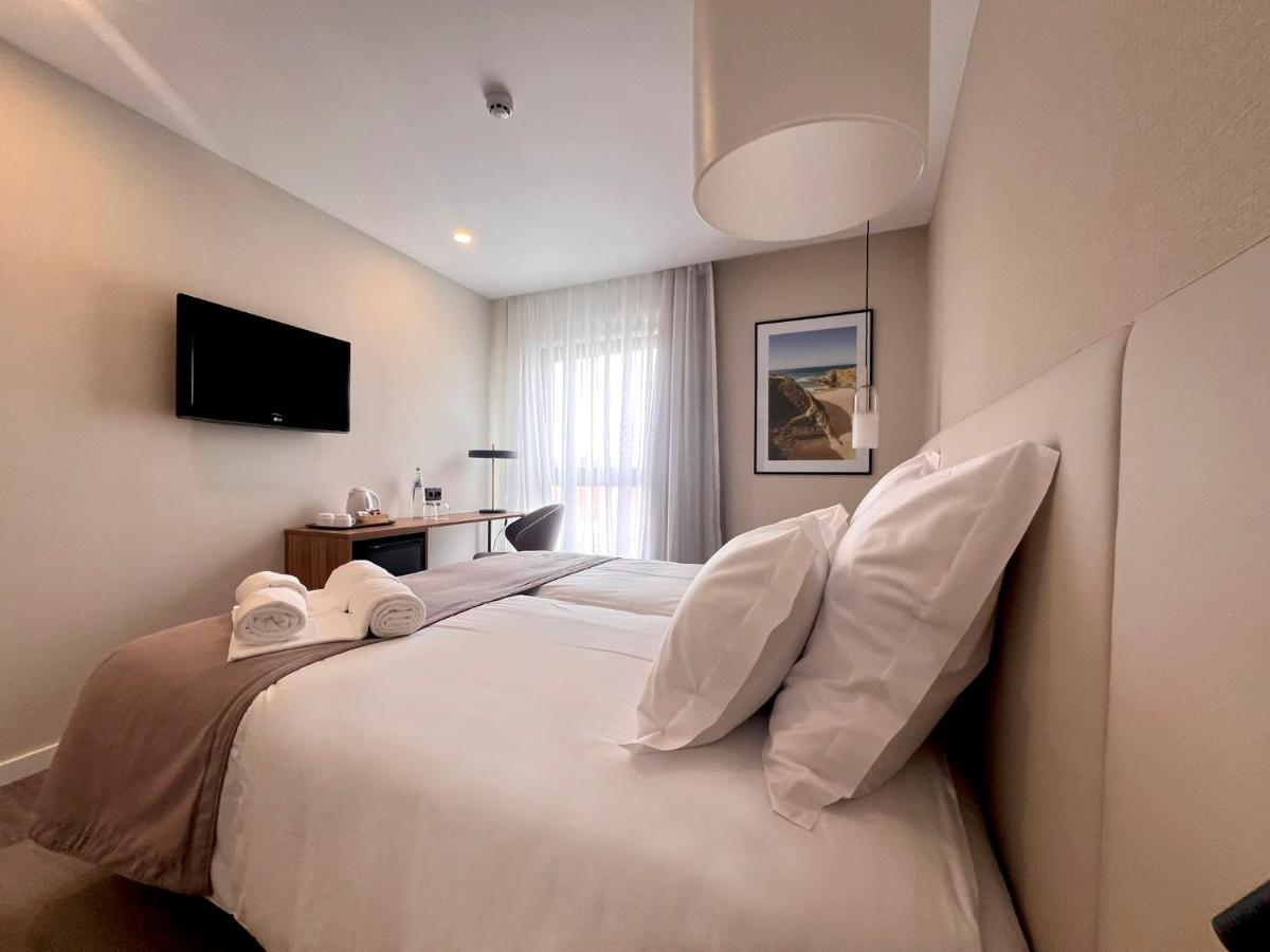 Uma cama ou camas num quarto em AP Sines - Costa Alentejana