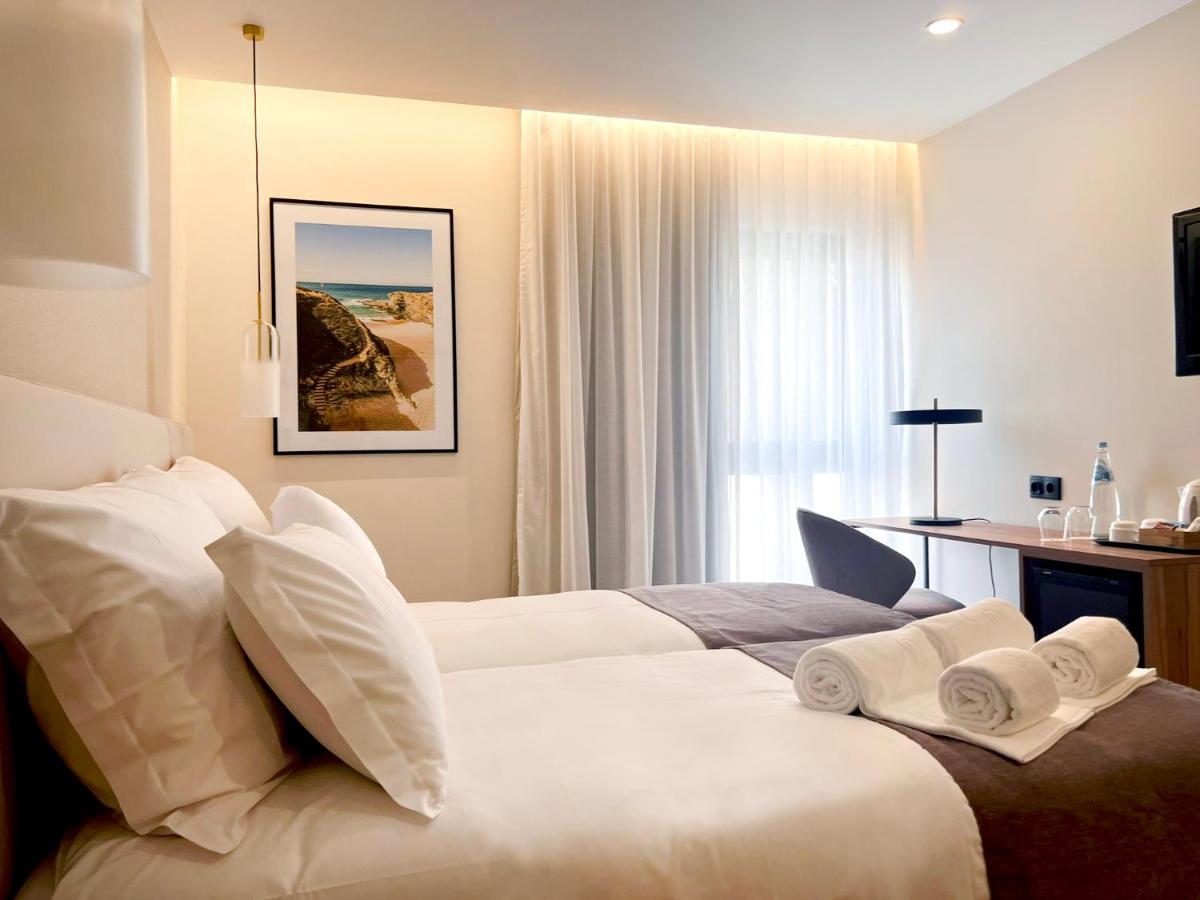 Uma cama ou camas num quarto em AP Sines - Costa Alentejana
