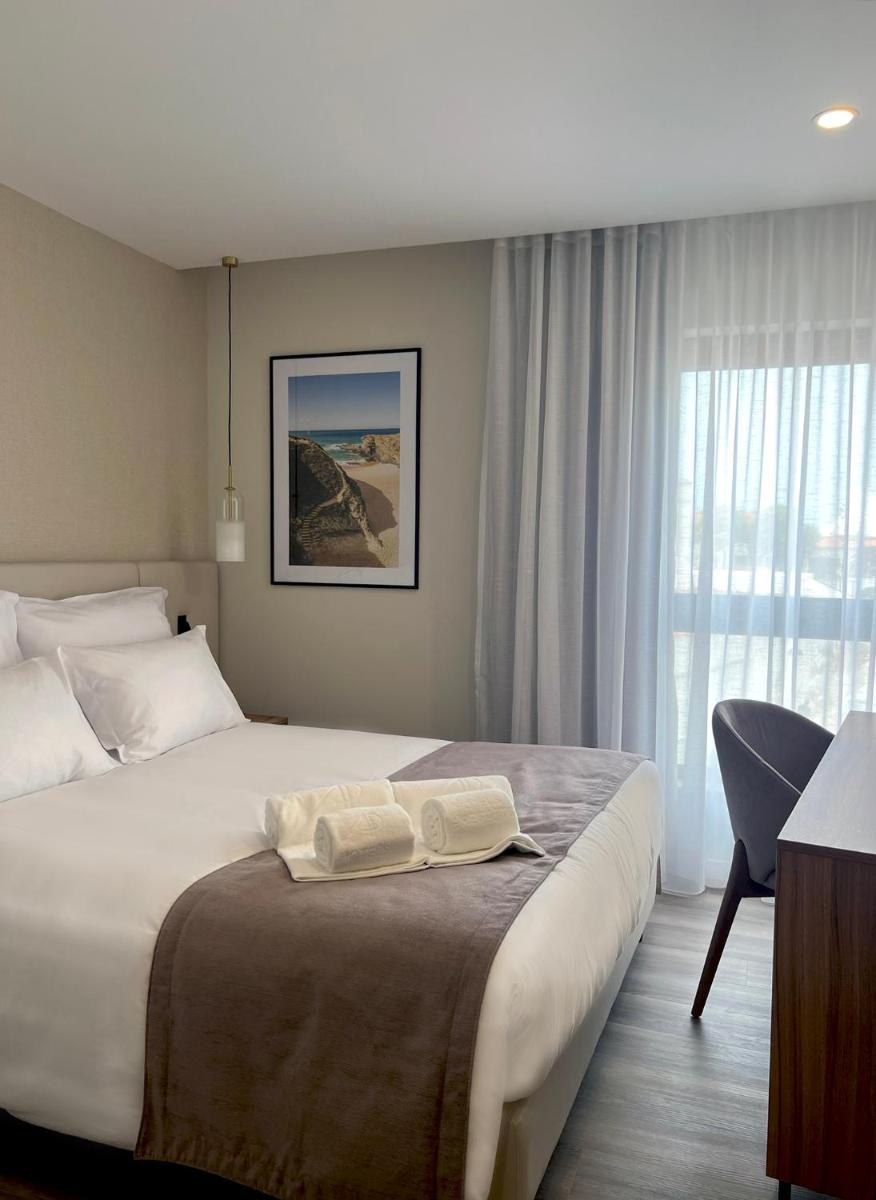 Uma cama ou camas num quarto em AP Sines - Costa Alentejana