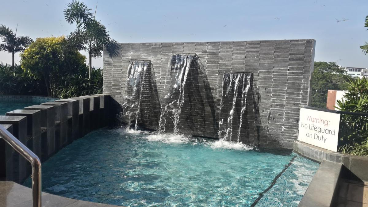 a water fountain in a pool in a resort at Welcomhotel by ITC Hotels, Richmond Road, Bengaluru in Bengaluru