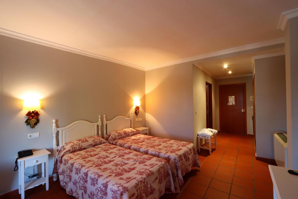 Cama o camas de una habitación en Hotel Varinia Serena - Balneario de Alange